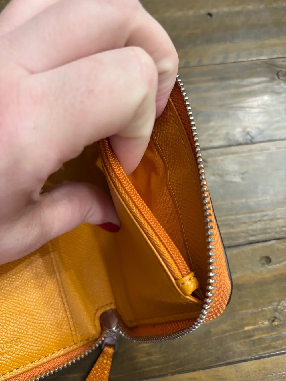 Coach Pebbled Leather Zip Wallet in Metallic Orange